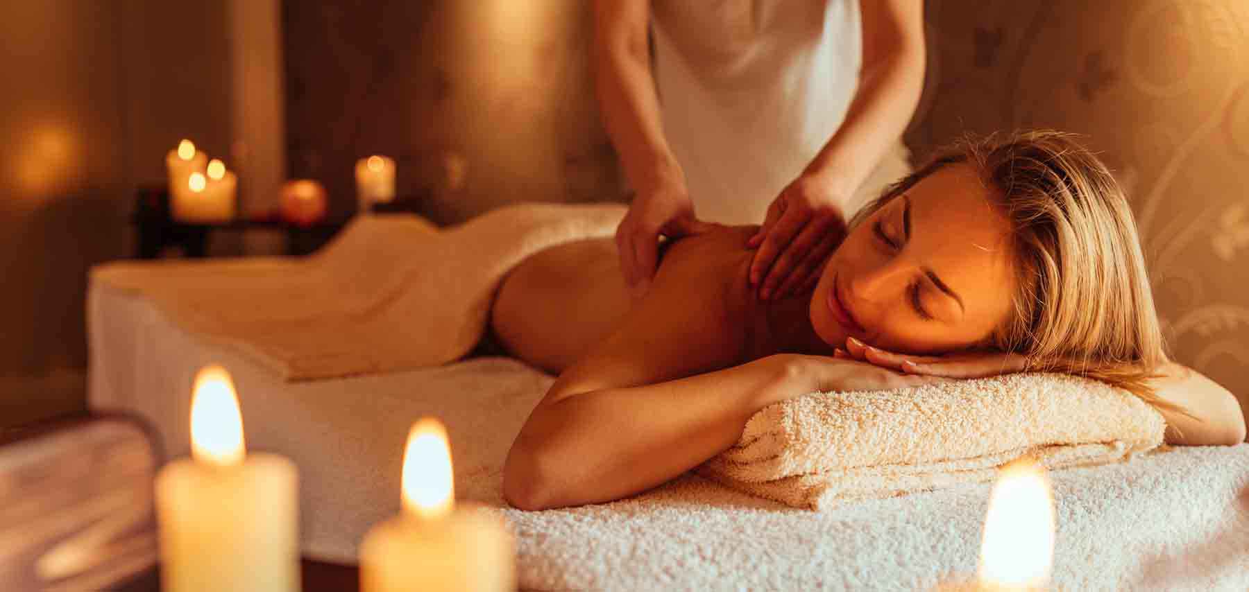 Young woman enjoying a massage at a spa